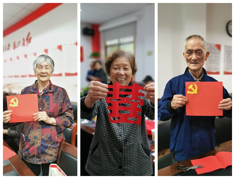 老人们展示剪纸作品