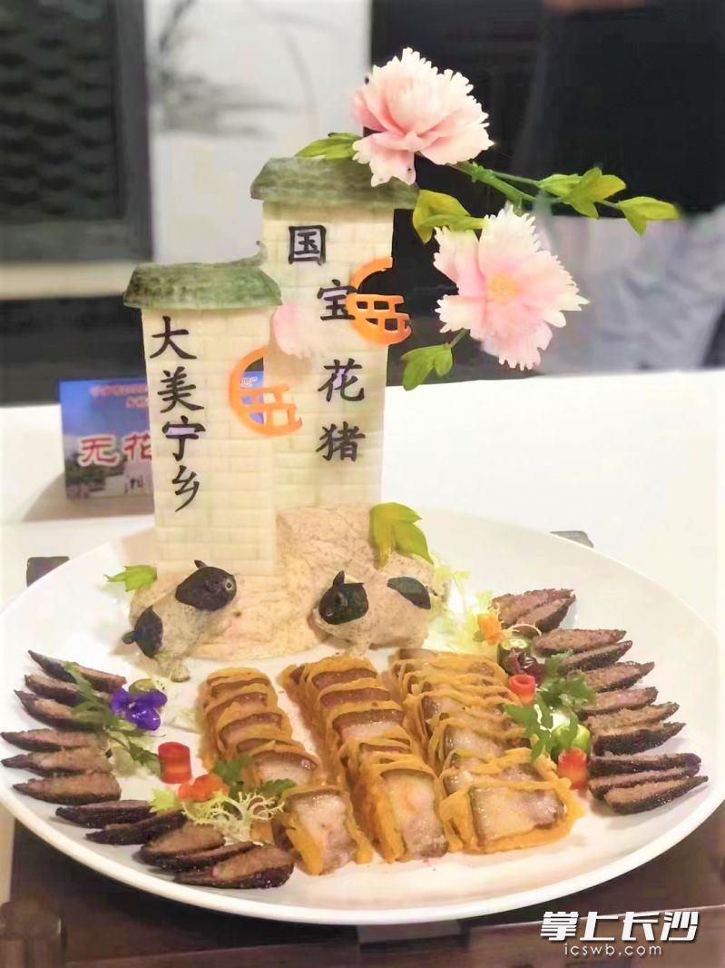 由乡村厨师陈益民制作的“国色天香”夺得美食大赛一等奖。