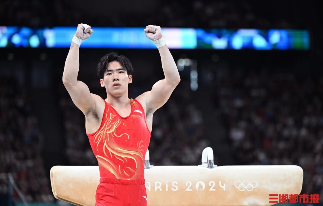 Zhang Boheng of Team China reacts after the pommel horse event during the men's team final of artistic gymnastics at the Paris 2024 Olympic Games in Paris, France, on July 29, 2024.