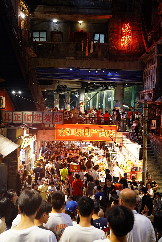 A commercial street is crowded with people, in Changsha, Hunan province, Aug 2, 2024. [Photo/VCG]