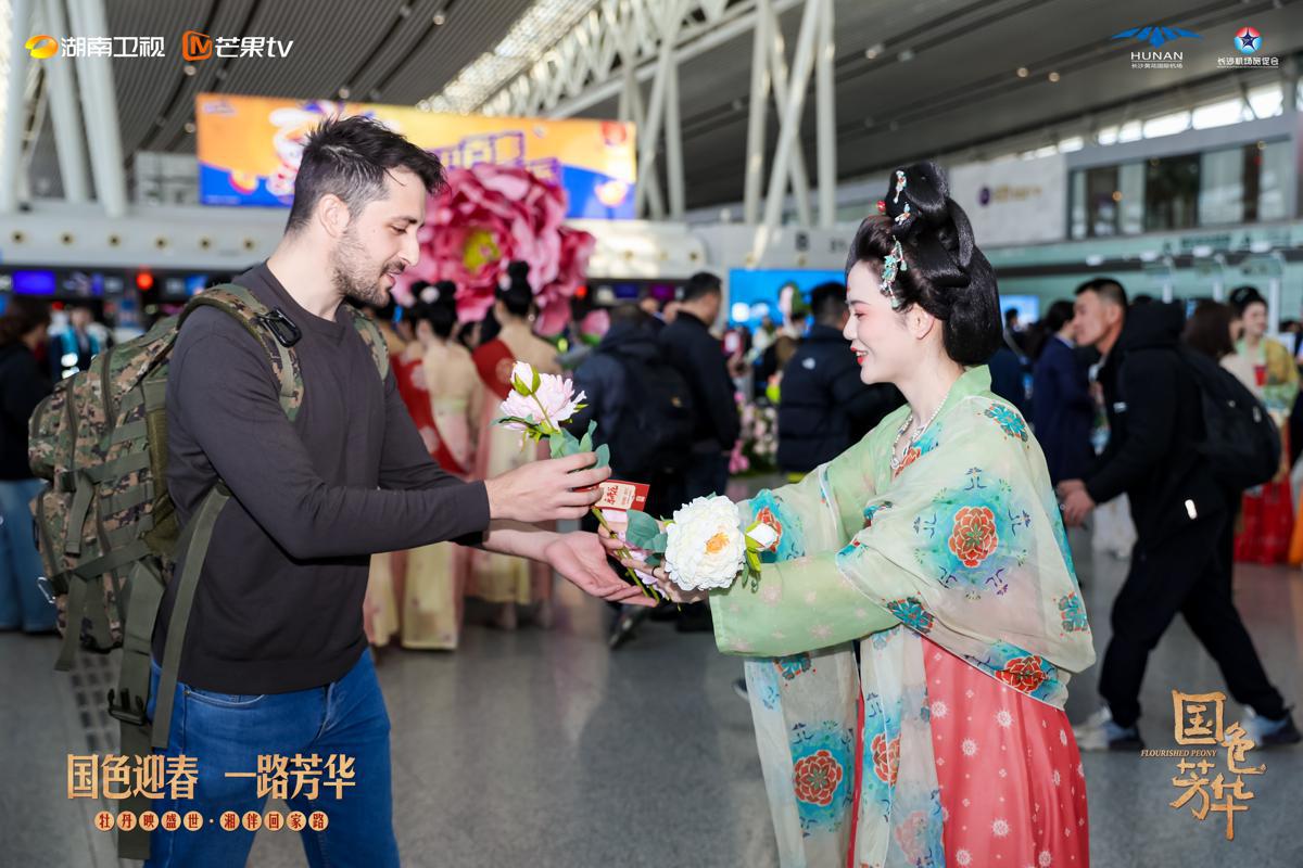 Staff members at Changsha Huanghua International Airport in Hunan province dress in costumes of the Tang Dynasty (618-907) to make the journey more pleasant for people traveling for the upcoming Spring Festival. [Photo provided to chinadaily.com.cn]