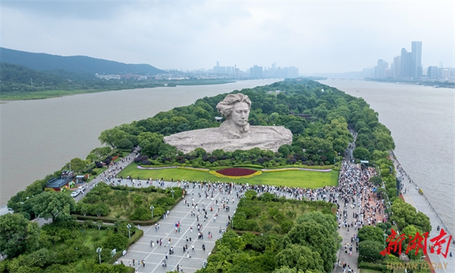 The photo, taken on June 2, shows residents and tourists visiting the Orange Isle Scenic Area in Changsha. 